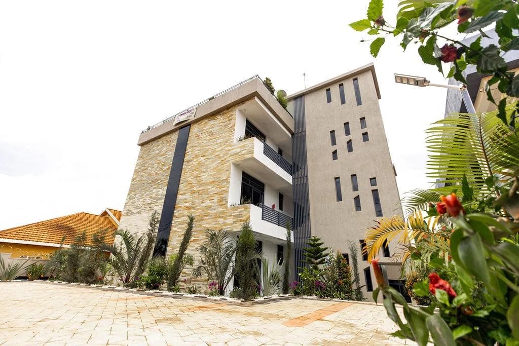 The Laurus Apartments building on KG 147 St, Kigali, seen from the paved parking courtyard